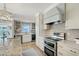 Bright, updated kitchen with stainless steel appliances and stone tile backsplash at 309 Avenida Milano, Sarasota, FL 34242