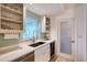 Gourmet kitchen featuring quartz countertops, modern appliances, and a stylish backsplash design at 309 Avenida Milano, Sarasota, FL 34242