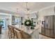 Kitchen featuring eat-in kitchen island, barstool seating and stainless steel appliances at 309 Avenida Milano, Sarasota, FL 34242