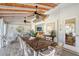 Bright sunroom with wooden ceiling, dining table, and comfortable seating at 309 Avenida Milano, Sarasota, FL 34242