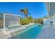 Inviting swimming pool with jacuzzi and tropical landscaping, perfect for outdoor relaxation at 309 Avenida Milano, Sarasota, FL 34242