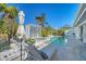 Luxurious pool area featuring a jacuzzi, lounge chairs, and lush tropical landscaping at 309 Avenida Milano, Sarasota, FL 34242