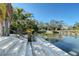 Waterfront property featuring a beautiful, landscaped walkway and canal access at 309 Avenida Milano, Sarasota, FL 34242