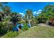 Picturesque backyard with a tranquil pond and lush green landscape at 3335 Brooklyn Ave, Port Charlotte, FL 33952