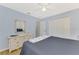 Bedroom with light blue walls, ceiling fan, and white wicker dresser at 3335 Brooklyn Ave, Port Charlotte, FL 33952