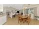 Open-concept dining area with ample natural light and seamless flow to the kitchen at 3335 Brooklyn Ave, Port Charlotte, FL 33952
