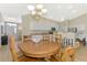 Dining area with an open-concept layout, bright lighting, and easy access to the kitchen at 3335 Brooklyn Ave, Port Charlotte, FL 33952