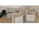 Bright kitchen with stainless steel appliances, breakfast bar, seamlessly connected to the living area at 3335 Brooklyn Ave, Port Charlotte, FL 33952