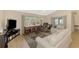 Bright living room with comfortable seating, a large window, and a view of the outdoors at 3335 Brooklyn Ave, Port Charlotte, FL 33952
