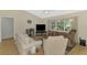 Inviting living room with a large window, comfortable seating, and a relaxing atmosphere at 3335 Brooklyn Ave, Port Charlotte, FL 33952