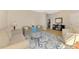 Spacious living room with hardwood floors, neutral colors and a cozy seating area at 3335 Brooklyn Ave, Port Charlotte, FL 33952