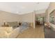 Bright and open living room with hardwood floors, neutral decor, and adjacent dining area at 3335 Brooklyn Ave, Port Charlotte, FL 33952