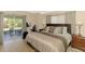 Spacious main bedroom with sliding glass doors, natural light, and neutral decor at 3335 Brooklyn Ave, Port Charlotte, FL 33952