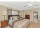 Comfortable main bedroom featuring neutral tones, a large bed, and plenty of natural light at 3335 Brooklyn Ave, Port Charlotte, FL 33952