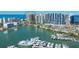 Stunning aerial view of the residences, showcasing waterfront access and marina with luxurious yachts at 35 Watergate Dr # 1101, Sarasota, FL 34236