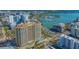 Stunning aerial view of a luxury high-rise with a pool and waterfront access at 35 Watergate Dr # 1101, Sarasota, FL 34236