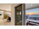 Relaxing balcony with seating, offering stunning sunset views over the water and city skyline at 35 Watergate Dr # 1101, Sarasota, FL 34236