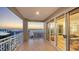 Expansive balcony with beautiful sunset views, overlooking the water and surrounding buildings at 35 Watergate Dr # 1101, Sarasota, FL 34236