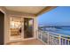 Balcony view showcasing the waterfront, city skyline, and a glimpse of the bedroom interior at 35 Watergate Dr # 1101, Sarasota, FL 34236