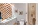 Modern bathroom with a unique vanity, accent wall, and glass-enclosed shower at 35 Watergate Dr # 1101, Sarasota, FL 34236