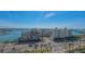 Waterfront condos overlook a busy street with beautiful views of a harbor, skyline, and bridge at 35 Watergate Dr # 1101, Sarasota, FL 34236