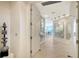 Inviting foyer featuring elegant tile flooring and modern art installations at 35 Watergate Dr # 1101, Sarasota, FL 34236