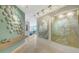 Stylish foyer with unique wall art and track lighting, leading to a spacious living area at 35 Watergate Dr # 1101, Sarasota, FL 34236