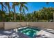 A private hot tub is surrounded by tropical landscaping offering a relaxing retreat, promising tranquility and privacy at 35 Watergate Dr # 1101, Sarasota, FL 34236