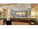 Contemporary kitchen featuring stainless steel appliances, granite countertops, and an open layout with water views at 35 Watergate Dr # 1101, Sarasota, FL 34236
