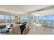 Spacious living room with floor-to-ceiling windows offering stunning views of the waterfront and city at 35 Watergate Dr # 1101, Sarasota, FL 34236
