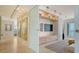 Open living room featuring modern decor, track lighting, and a sliding glass door with ocean views at 35 Watergate Dr # 1101, Sarasota, FL 34236