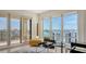 Bright living room with floor-to-ceiling windows offering beautiful views of the city and water at 35 Watergate Dr # 1101, Sarasota, FL 34236
