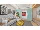 Bright living room featuring a comfortable sectional sofa, contemporary art, and modern track lighting at 35 Watergate Dr # 1101, Sarasota, FL 34236