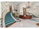 Elegant building lobby featuring a grand staircase, chandelier, and concierge desk at 35 Watergate Dr # 1101, Sarasota, FL 34236