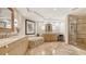 Spa-like main bathroom with a soaking tub, dual vanities, and a walk-in shower at 35 Watergate Dr # 1101, Sarasota, FL 34236