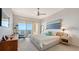 Cozy main bedroom with calming decor and a private balcony overlooking the water at 35 Watergate Dr # 1101, Sarasota, FL 34236