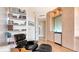 Bright office space with custom built-ins and a comfortable reading chair at 35 Watergate Dr # 1101, Sarasota, FL 34236