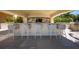 Outdoor bar seating with modern tiled backsplash and sink at 35 Watergate Dr # 1101, Sarasota, FL 34236