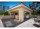Outdoor patio area with tiled roof, outdoor kitchen, and several seating options at 35 Watergate Dr # 1101, Sarasota, FL 34236