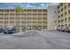Multi-story condo building with ample parking and view of balconies at 3658 Lake Bayshore Dr # 320, Bradenton, FL 34205