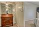 Hallway view featuring a wooden dresser and a partial view of the bedroom at 3658 Lake Bayshore Dr # 320, Bradenton, FL 34205