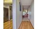 Interior hallway with hardwood floors leading to the living room and kitchen at 3658 Lake Bayshore Dr # 320, Bradenton, FL 34205