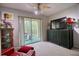 Bright living room featuring a ceiling fan and access to a private balcony at 3658 Lake Bayshore Dr # 320, Bradenton, FL 34205