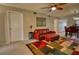 Comfortable living room features a leather sofa, bright rug and ceiling fan at 3658 Lake Bayshore Dr # 320, Bradenton, FL 34205