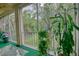 Relaxing screened porch featuring nice plants, furniture, and a view at 3658 Lake Bayshore Dr # 320, Bradenton, FL 34205