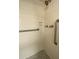 Shower stall with white subway tile and grab bars at 3658 Lake Bayshore Dr # 320, Bradenton, FL 34205