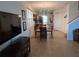 Open concept living space connecting dining area and kitchen, with tile flooring throughout at 3780 82Nd Avenue E Cir # 101, Sarasota, FL 34243