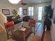 Open floor plan with dining area visible, tile floors and a view to the living room and front door at 3780 82Nd Avenue E Cir # 101, Sarasota, FL 34243