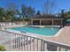 Sparkling community pool with lounge chairs and a covered pavilion at 3780 82Nd Avenue E Cir # 101, Sarasota, FL 34243