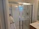 Bathroom shower with a sliding glass door and a multi-setting shower head at 3780 82Nd Avenue E Cir # 101, Sarasota, FL 34243